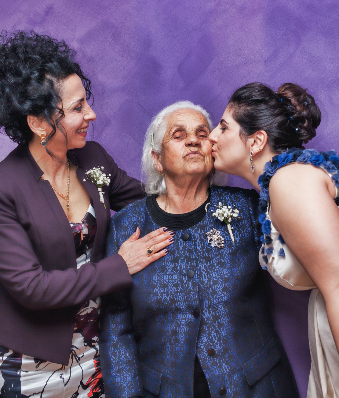 woman kissing woman s cheek
